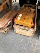 A VINTAGE CHILDS BRICK TROLLEY A ANTIQUE SEED DISTRIBUTOR AND A WOODEN BOTTLE CREATE