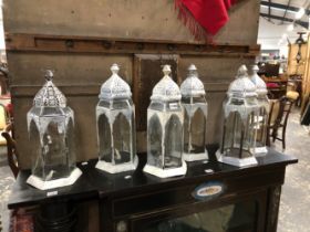 SIX GLAZED WHITE PAINTED METAL PRICKET CANDLESTICK LANTERNS