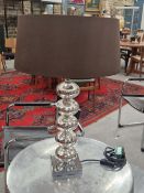 A PAIR OF CHROME TABLE LAMPS, EACH ON COLUMNS WITH FIVE BUN SHAPES ABOVE SQUARE FEET