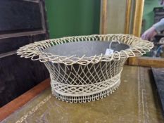 A PAIR OF OVAL WIRE WORK BASKETS AND ONE GALVANISED LINER, EACH BASKET WITH A FLARED RIM. W 44cms.