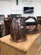 A 19th C. COPPER JUG WITH A BRAZED SEAM BY THE RIVETTED HANDLE. H 29cms. TOGETHER WITH A PAIR OF