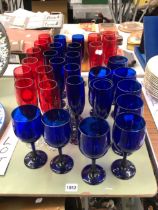 A QUANTITY OF BLUE AND RED DRINKING GLASSWARES