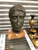 A BRONZED PLASTER HEAD OF A LADY