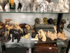 A COLLECTION OF DOG AND OTHER FIGURINES.