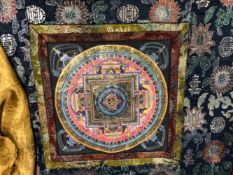 A TIBETAN THANGKA THE SQUARE PAPER PANEL PAINTED WITH A CHAKRA WITH STUPA SPANDRELS AND MOUNTED ON A