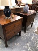 A PAIR OF 20th C. HARD WOOD TWO DRAWER BEDSIDE TABLES ON SQUARE SECTIONED LEGS