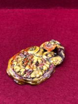 A CHINESE PORCELAIN LINGZHIH FORM SMALL PALLETTE OR BRUSH REST DECOARATED IN NATURALISTIC