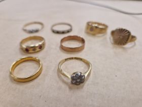 GOLD RINGS. A 22ct HALLMARKED GOLD WEDDING BAND 3.59 gms, AN 18ct GOLD DIAMOND DAISY HEAD RING, AN