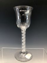 AN 18th C. DOUBLE HELIX OPAQUE TWIST WINE GLASS WITH A BELL BOWL AND CIRCULAR FOOT. H 17cms.