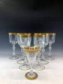 A SET OF SIX FRENCH GILT WINE GLASSES ON STEMS WITH FROSTED DIAMOND DIAPER CUT KNOPS, TWO OTHERS