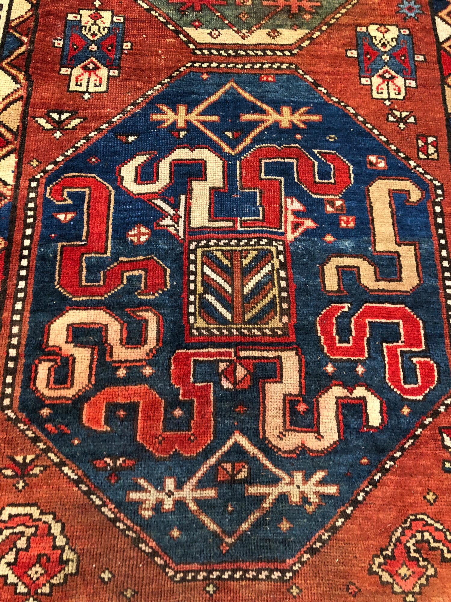 AN ANTIQUE CAUCASIAN KAZAK RUG. 272 x 127cms - Image 2 of 3