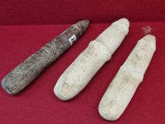 A GROUP OF THREE ANTIQUE AFRICAN CARVED STONE PESTLE OF PHALLIC FORM.