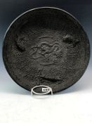 AN ANTIQUE CHINESE BRONZE DISH CAST WITH TWO FISH AND A LOBSTER ENCLOSING THE CENTRAL DRAGON
