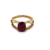 A 9ct HALLMARKED GOLD OVAL RUBY SOLITAIRE RING IN A FOUR CLAW SETTING. FINGER SIZE N. WEIGHT 2.