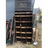 A VINTAGE STEEL PARTS RACK OF PIGEON HOLE TYPE TOGETHER WITH A TIN TRUNK.