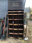 A VINTAGE STEEL PARTS RACK OF PIGEON HOLE TYPE TOGETHER WITH A TIN TRUNK.