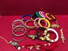 A COLLECTION OF INDIAN BANGLES AND OTHER EASTERN JEWELLERY.