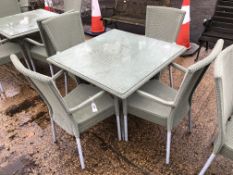 A SQUARE LLOYD LOOM PATION TABLE AND 4 MATCHING CHAIRS
