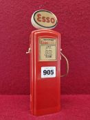 A RED PLASTIC ESSO PETROL PUMP MONEY BOX WITH GILBARCO PAPER LABELLING. H 22.5cms.