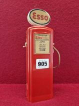 A RED PLASTIC ESSO PETROL PUMP MONEY BOX WITH GILBARCO PAPER LABELLING. H 22.5cms.