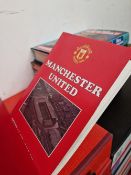 A EXTENSIVE COLLECTION OF MANCHESTER UNITED FOOTBALL PROGRAMS AND CLUB MAGAZINES.