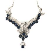 A SAPPHIRE AND DIAMOND SET NECKLACE. THE CENTREPIECE IN A FOLIATE DESIGN SUSPENDED FROM A SQUARE CUT