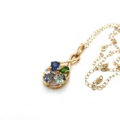 A MULTI GEM SET INFINITY STYLE PENDANT, STAMPED 10K, ASSESSED AS 10ct GOLD SUSPENDED ON A 9ct GOLD