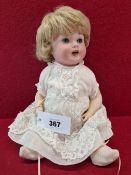 A PORZELLANFABRIK MENGERSGEREUTH 914 BISQUE HEADED DOLL WITH SLEEPING EYES AND OPEN MOUTH. H 34cms.