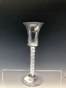 AN 18th C. DOUBLE HELIX OPAQUE TWIST WINE WITH A SLENDER BELL BOWL AND CIRCULAR FOOT. H 15cms.
