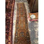 AN ANTIQUE PERSIAN HAMADAN RUNNER. 270 x 59cms