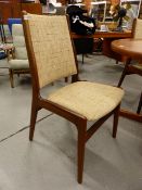 A SET OF SIX TEAK DINING CHAIRS UPHOLSTERED AT THE SEAT AND BACKS IN OATMEAL MATERIAL