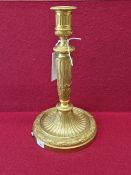 AN ORMOLU CANDLESTICK TABLE LAMP, THE FLUTED COLUMN WITH FOLIAGE BANDS. THE CIRCULAR FOOT WITH A