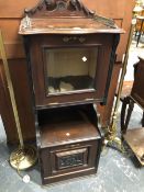 A VICTORIAN MAHOGANY MUSIC CABINET, THE BRASS GALLERIED TOP ABOVE A GLAZED DROP DOWN DOOR, A SHELF