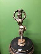 AN INDIAN BRONZE FIGURE OF A LADY DANCING WITH HER HANDS ABOVE HER HEAD. H 44cms.