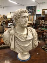 AN FAUX MARBLE BUST OF A ROMAN EMPEROR. H 82cms.