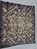 A BLACK SILK PANEL EMBROIDERED IN GOLD THREAD AND SEQUINS, POSSIBLY OTTOMAN, SEWN WITH CHEVRON BANDS