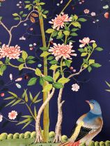 TWO PANELS OF WALL PAPER PRINTED WITH EXOTIC BIRDS AMONGST FLOWERING TREES AGAINST AN INTENSE SKY