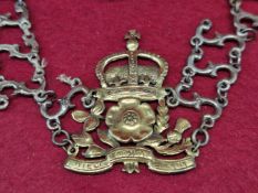A LIVERY COLLAR OF ESSES SUPPORTING A GILT CROWNED TUDOR ROSE FLANKED BY A THISTLE AND SHAMROCK