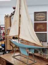 A BLUE HULLED POND YACHT NAMED WHO CARES, FROM STERN TO BOW SPRIT. 199cms.