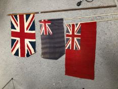 A UNION FLAG ON A POLE TO BE HAND HELD, A RED ENSIGN AND A BLUE ENSIGN FLAG ALSO ON POLES