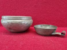 A RARE TUDRIC PEWTER TASTEVIN PATTERN NUMBER 0185. TOGETHER WITH A HUGH WALLIS LIDDED PEWTER