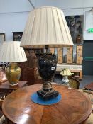 AN ORMOLU MOUNTED BLACK STONE BALUSTER TABLE LAMP WITH FLORAL SWAGS ON THE SHOULDERS AND A WREATH