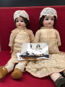 TWO ARMAND MARSEILLE 390 BISQUE HEADED DOLLS, BOTH WITH FIXED EYES AND OPEN MOUTHS. H 38 AND 31cms.