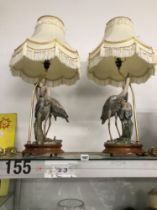 A PAIR OF DECORATIVE  CAPODIMONTE TABLE LAMPS WITH CRANE FIGURE SUPPORT