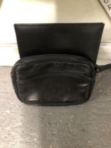 A GUCCI BLACK LEATHER FOLDER TOGETHER WITH A DUNHILL LEATHER ZIP BAG