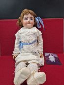 A LANTERNIER CHERIE BISQUE HEADED DOLL WITH FIXED EYES AND OPEN MOUTH. H 58cms.