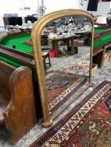 A LARGE VICTORIAN OVER MANTEL MIRROR