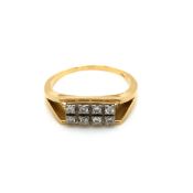 A VINTAGE SEVEN STONE DIAMOND GENTS RING. UNHALLMARKED, MARK RUBBED, ASSESSED AS 18ct GOLD. FINGER
