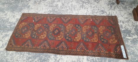 AN ANTIQUE AFGHAN RUNNER. 230 x 101cms