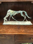 MANNER OF ALBERTO GIACOMETTI GREEN PATINATED BRONZE FIGURE OF A STYLIZED DOG. W 59cms.